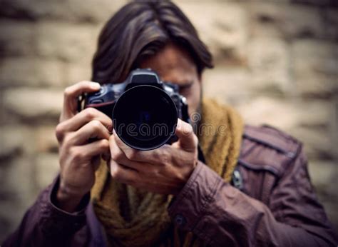 Photography Is My Passion A Handsome Young Photographer At Work In The