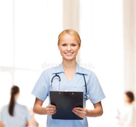 Smiling Female Doctor Or Nurse With Clipboard Stock Image Image Of