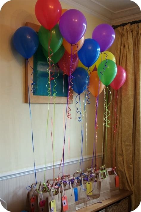 Balloons Attached To Favor Bags Rainbow Themed Birthday Party