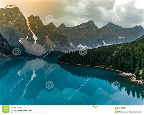 Sunrise With Turquoise Waters Of The Moraine Lake With Sin Lit Rocky