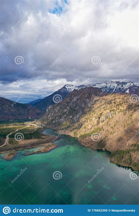 Aerial View Of Almsee Lake In The Austrian Alps During Spring Stock