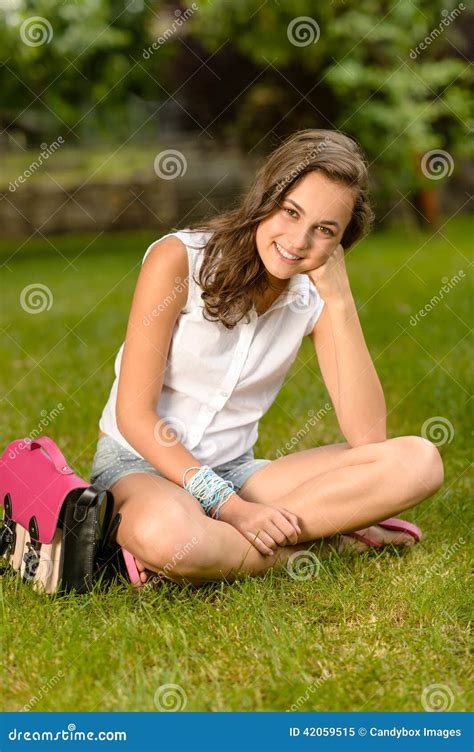 Smiling Teenage Girl Sitting Grass With Satchel Stock Image Image Of
