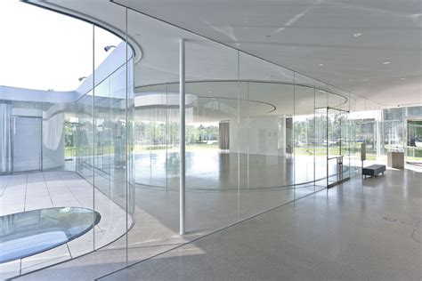 Nearly Invisible Sanaas Minimalistic Curved Glass Façades