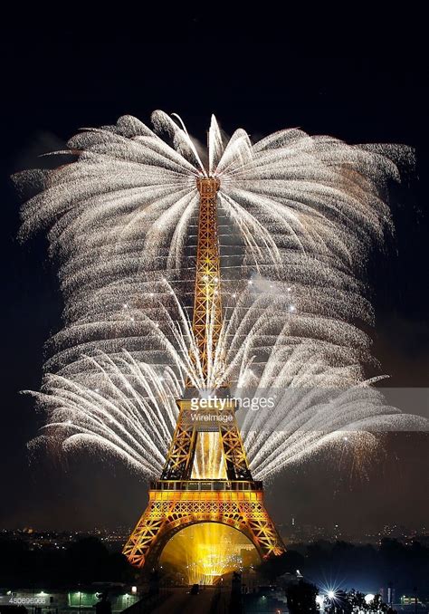 Fireworks Burst Around The Eiffel Tower As Part Of Bastille Day