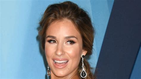 Jessie James Decker Is Unbuttoned Lifts Shirt To Put It In The Cart