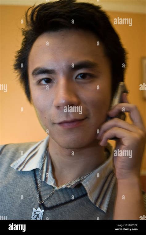 Portrait Young Asian Student Using Smart Phone In Close Up Man Face