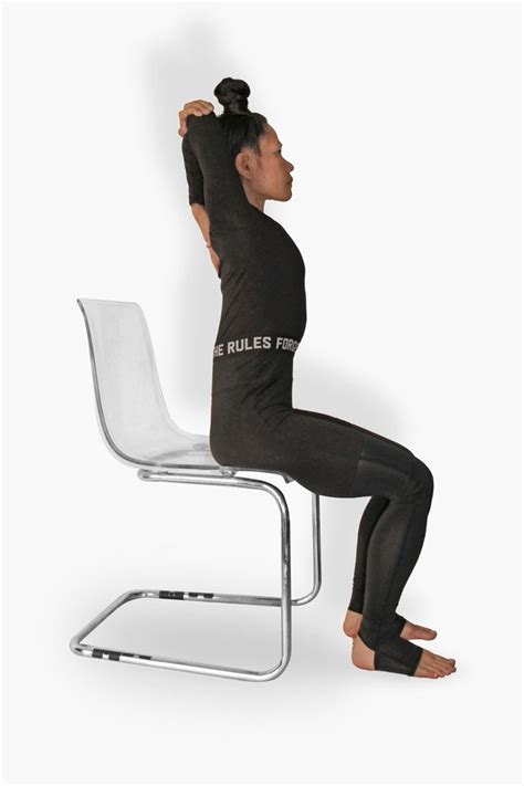 11 Yoga Poses You Can Do At Your Desk The National Yoga Poses