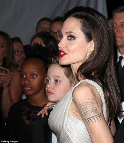 Angelina Jolie Shows Off Long Legs In Gleaming Gown At Annie Awards