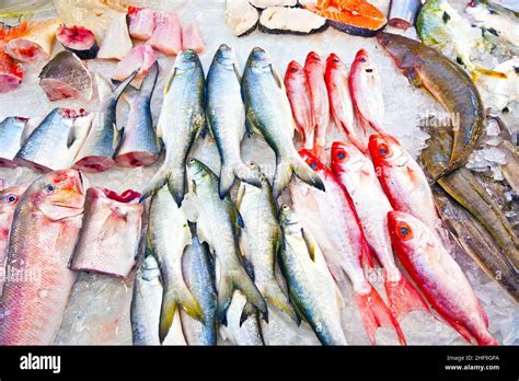 Whole Fresh Fishes Are Offered In The Fish Market In Asia Stock Photo