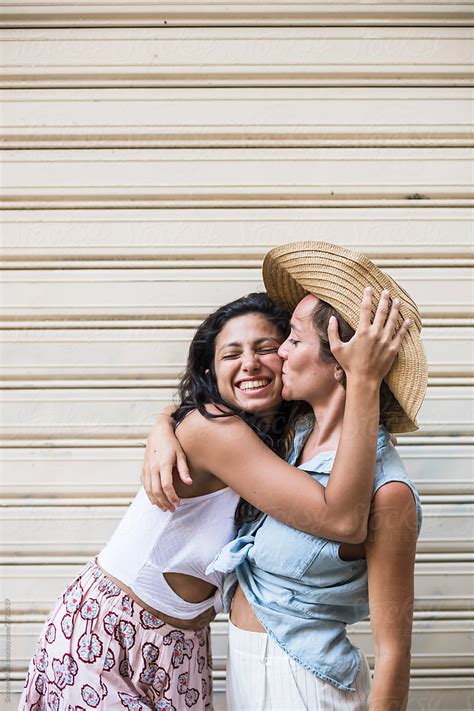 Friends Hugging And Smiling By Stocksy Contributor Simone Wave Stocksy