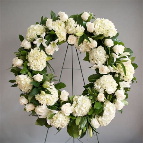 White Roses Carnations And Stargazer Funeral Flower Arrangements