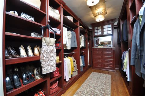 We hand crafted our cabinets with the finest quality materials. His & Hers walk-in closet. Featured at a designer ...