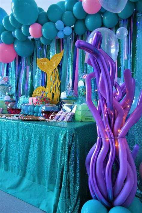 An Under The Sea Themed Birthday Party With Balloons Streamers And