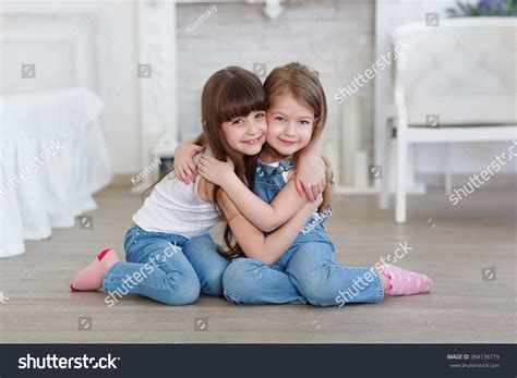 Two Little Girls Sisters Hugging Stock Photo 394136779 Shutterstock