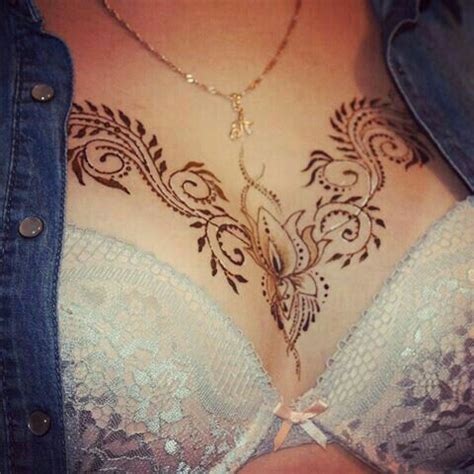 It is another risky option to wear a tattoo on the neckline since this time the design is done on the lower part of the woman's chest. Pin by Michelle Walker on Chest Tattoos in 2020 | Henna ...