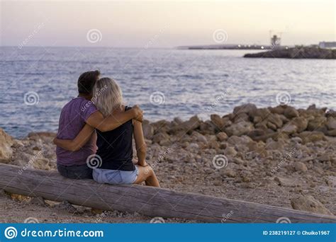 Couple In Love Watching Sunset Together On Beach Travel Summer Holidays Stock Image Image Of