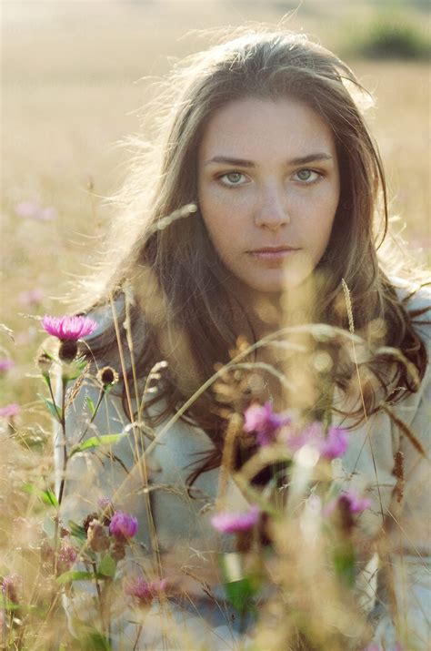 Portrait Of Brunette Girl On The Meadow In Contra Light Del