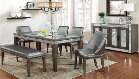 Dark gray rustic dining room interior with a long wooden table, and two long benches. Sturgis Dark Gray Extendable Rectangular Dining Table from ...