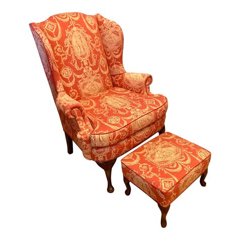 Update your home decor with the elegance and luxury of this rounded arm transitional wingback chair and ottoman set with dark espresso finished wood legs. Antique Red Toile Wingback Chair and Ottoman | Chairish