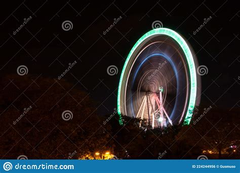 Long Exposure Picture Of Highlighted Giant Ferris Wheel In Amusement