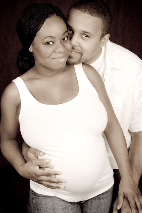 This Is A Portrait Of An African American Couple That Is Expecting
