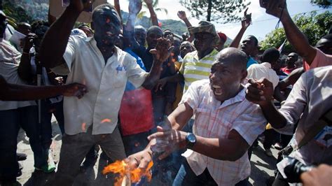 Thousands Of Haitian Protesters Decry Violence Against Countrymen In