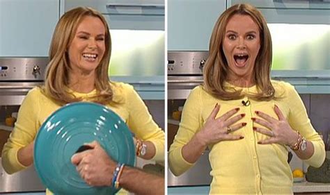 Amanda Holden Cheekily Pretends To Flash Her Chest Towards The Camera