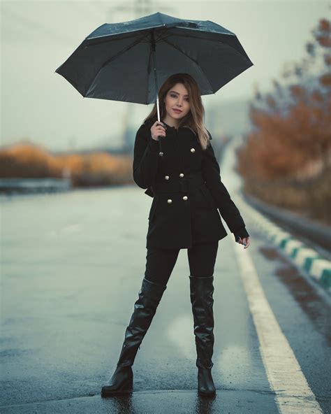 Woman Standing On A Road Holding An Umbrella Model Poses Standing
