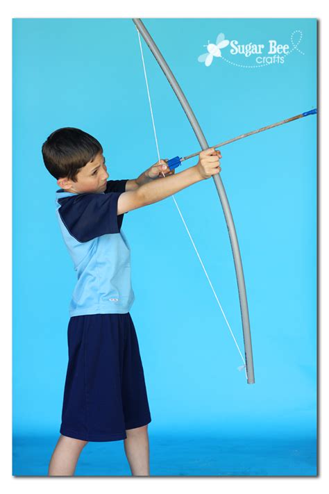 Attach the arrow's nock — the plastic, grooved part at the arrow's end — to the bow string. Bow and Arrow! | Bee crafts, Homemade bows, Girls camp crafts