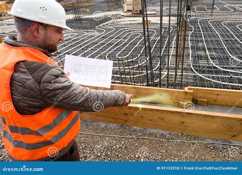 Construction Supervisor With Plan Marking The Site Stock Photo Image