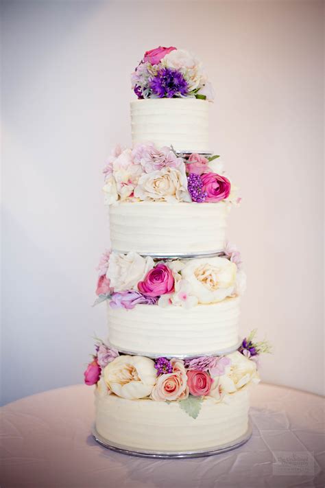The reception venue music & entertainment speeches cake drinks. Wedding Cake (silk flowers) $695 • Temptation Cakes ...