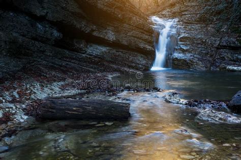 Beautiful Waterfall At Mountain River In Colorful Autumn Forest With