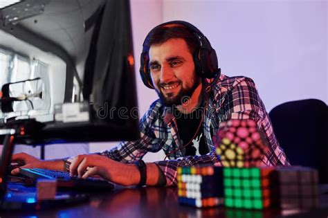 Portrait Of Young Bearded Pro Gamer Playing In Online Video Game Stock