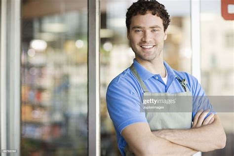 Shopkeeper Smiling By Storefront High Res Stock Photo Getty Images