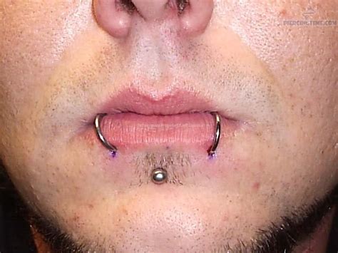 Enhance your beauty through piercing, ear piercings, nose piercing, helix piercing, daith piercing, septum piercing, tragus piercing, industrial piercing, medusa piercing, ear plug and fashion jewelry. Girl Have Septum, Medusa And Lower Lip Dolphin Bites Piercing