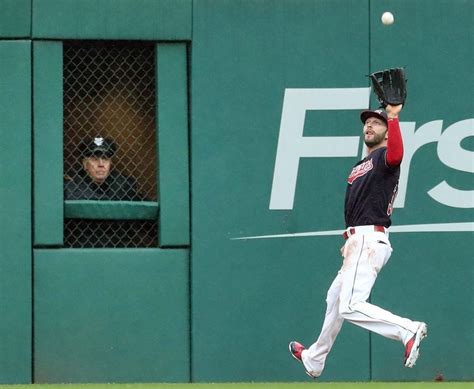 cleveland indians tyler naquin shags the fly ball hit by the chicago cubs addison russell in the