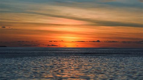Download Wallpaper 1366x768 Sea Horizon Sunset Clouds