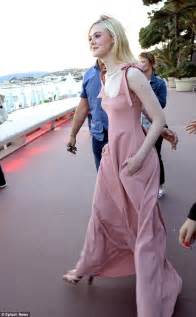Cannes Elle Fanning Is Caught Off Guard By The Wind Daily Mail