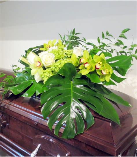 Singer aaliyah's funeral procession arrives at st. Funeral & Sympathy casket flowers roses