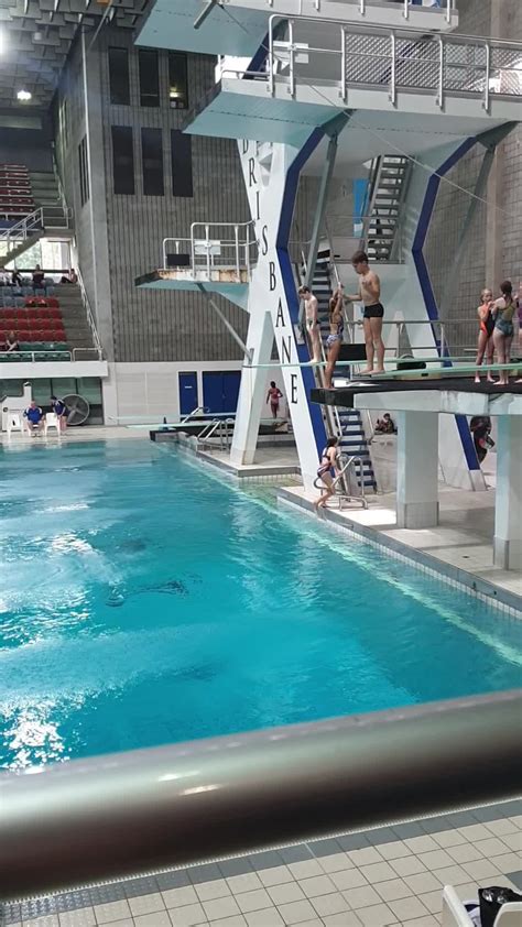 Guy Trying To High Dive Into Swimming Pool Overturns During Descent