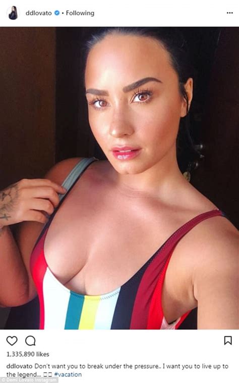 Demi Lovato Showcases Her Assets In Plunging Striped Bathing Suit Daily Mail Online