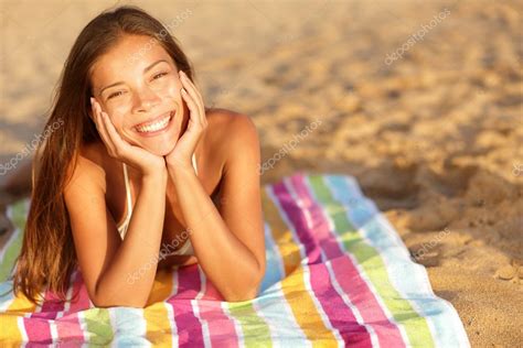 Beautiful Woman Sunbathing On The Beach Stock Photo By Maridav