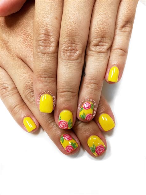 Yellow nails. Floral nails. She said it reminds her of a Mexican