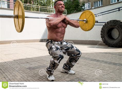 Bodybuilder Doing Front Squats With Barbells Stock Photo Image Of