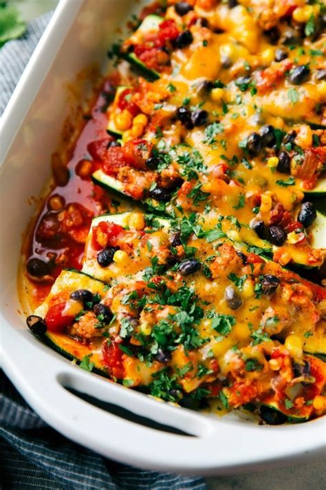 Zucchini boats loaded with lentils and sautéed baby spinach in a lightly spicy tomato sauce and covered with shredded. Enchilada Stuffed Zucchini Boats | Chelsea's Messy Apron