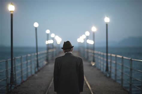 Senior Man Standing On A Bridge By Thanasis Zovoilis