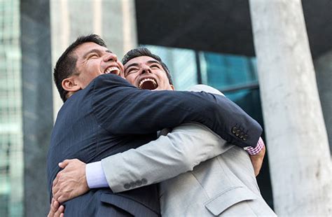 Two Men In Suits Hugging Stock Photos Pictures And Royalty Free Images