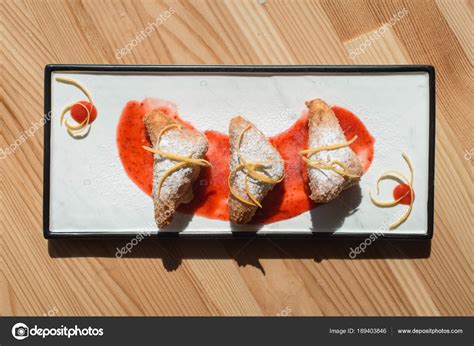 Spanish Leche Frita Dessert Decorated With Jam Close Up On A Plate