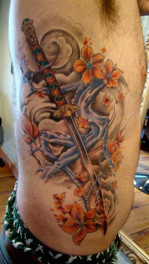 Tattoo.com was founded in 1998 by a group of friends united by their shared passion for ink. Asian traditional colorful side tattoo of samurai sword ...