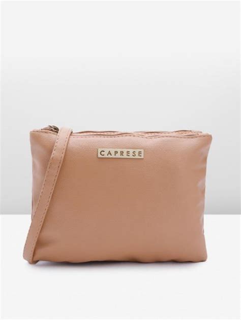 Caprese Nude Coloured Synthetic Leather Solid Sling Bag JioMart